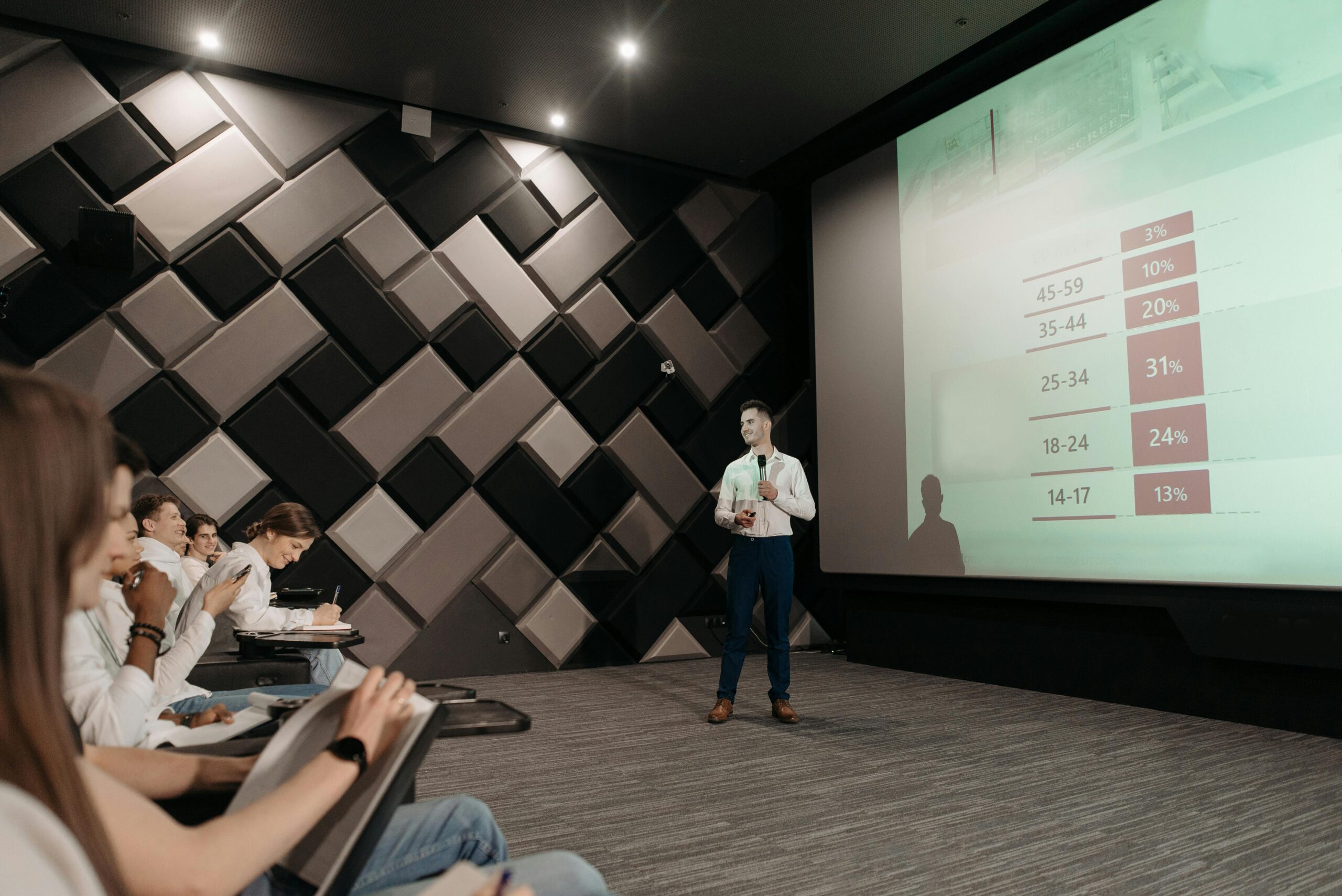 Professional business presentation in a modern conference room with attentive audience.